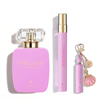 Pink 'PUREAMOR' perfume set with perfume bottle, travel spray, and keychain on a white background