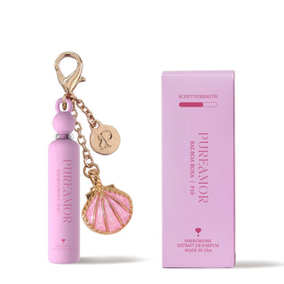 Pink perfume bottle 2ml keychain with shell charm and packaging on a white background