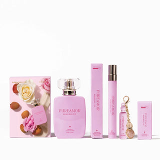 Collection of pink 'PUREAMOR' perfume products on a white background