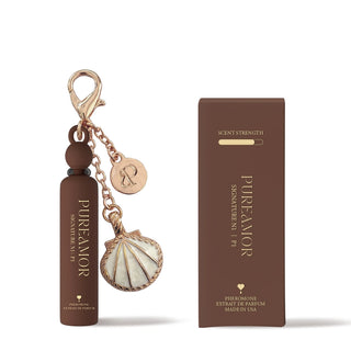 2ml Keychain with shell charm and packaging of Pure Amor product on a white background