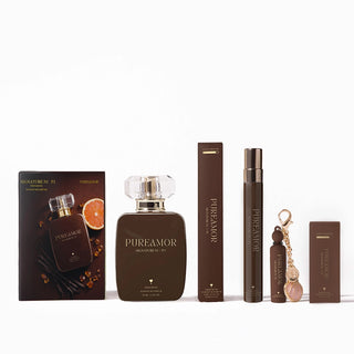 Collection of PureAmor perfume products including a bottle, travel spray, and keychain on a white background.