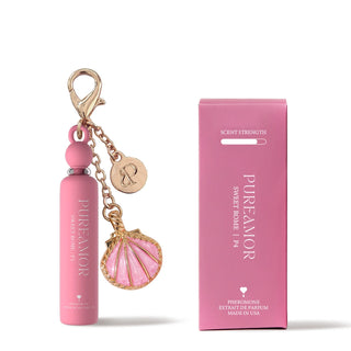Pink 2ml keychain with shell charm and packaging on a white background