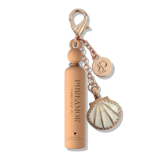 2ml Keychain with bottle-shaped charm and shell pendant on a white background