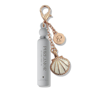 2ml Keychain with a bottle-shaped charm and shell pendant on a white background