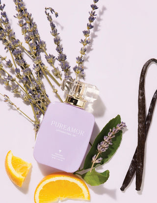 30ml Perfume bottle labeled 'PUREAMOR' with lavender, oranges, and vanilla bean on a light background