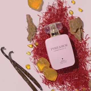 PureAmor Saffron Rouge pheromone 30ml perfume bottle surrounded by amber and incense, creating a tranquil and earthy atmosphere
