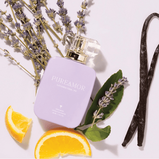 PureAmor Lavanda Vida perfume 30ml bottle surrounded by orange slices and vanilla pods, offering a delicate and fresh fragrance
