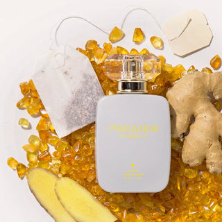 30ml Perfume bottle labeled 'PHREAMOR' surrounded by ginger and amber on a light background